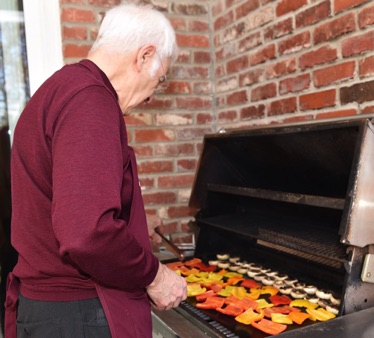 Charles grilling Bell Peppers and Mushrooms